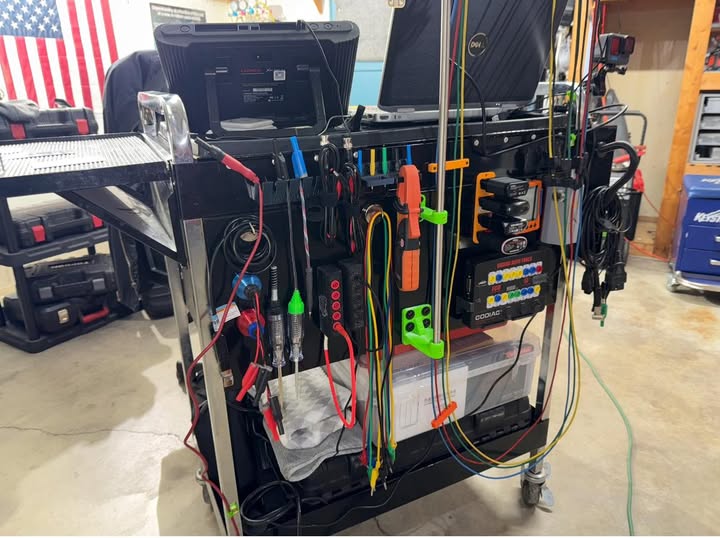 Rolling diagnostic cart loaded with colored probes and leads